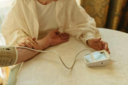 Person using a digital blood pressure monitor for accurate measurement